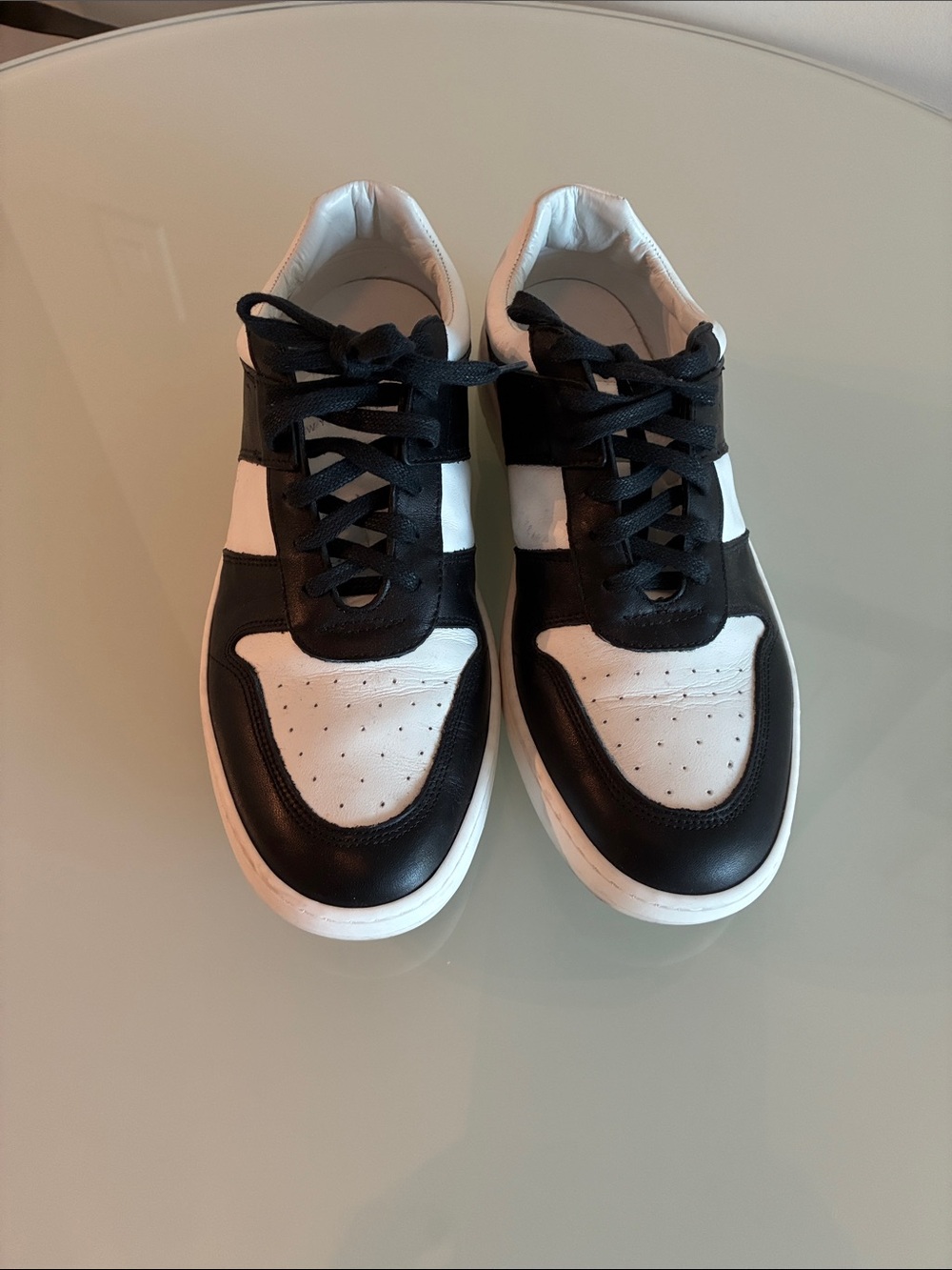 Koio black and white women’s sneakers, size 11.